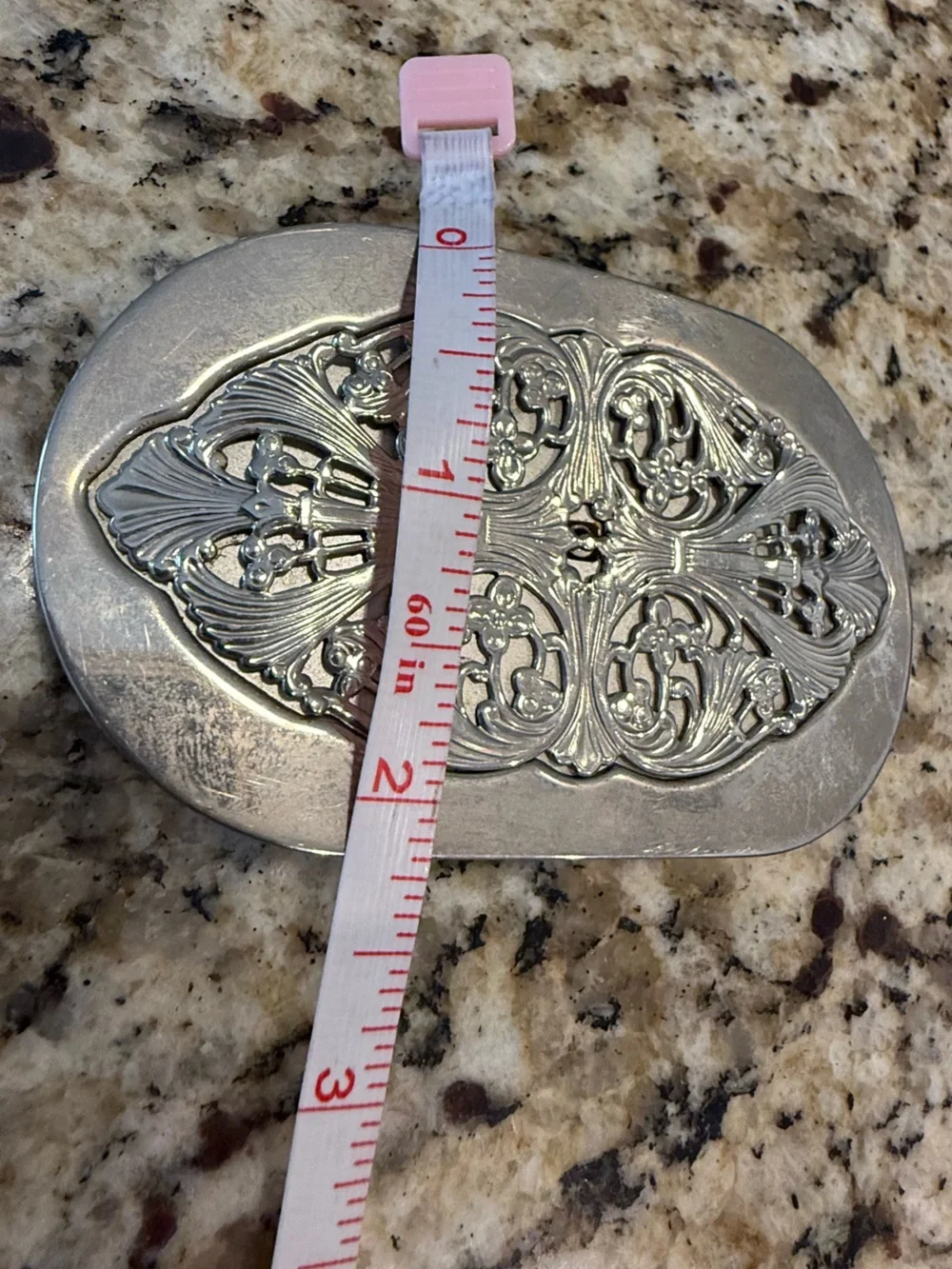 Western silver tone ornate floral scrolled belt buckle